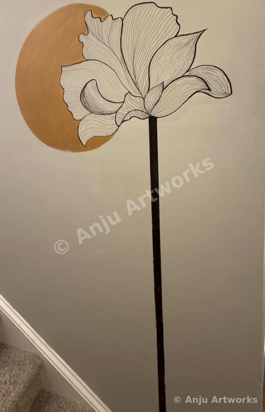 Line art lotus mural with golden sun painted on a stairwell wall